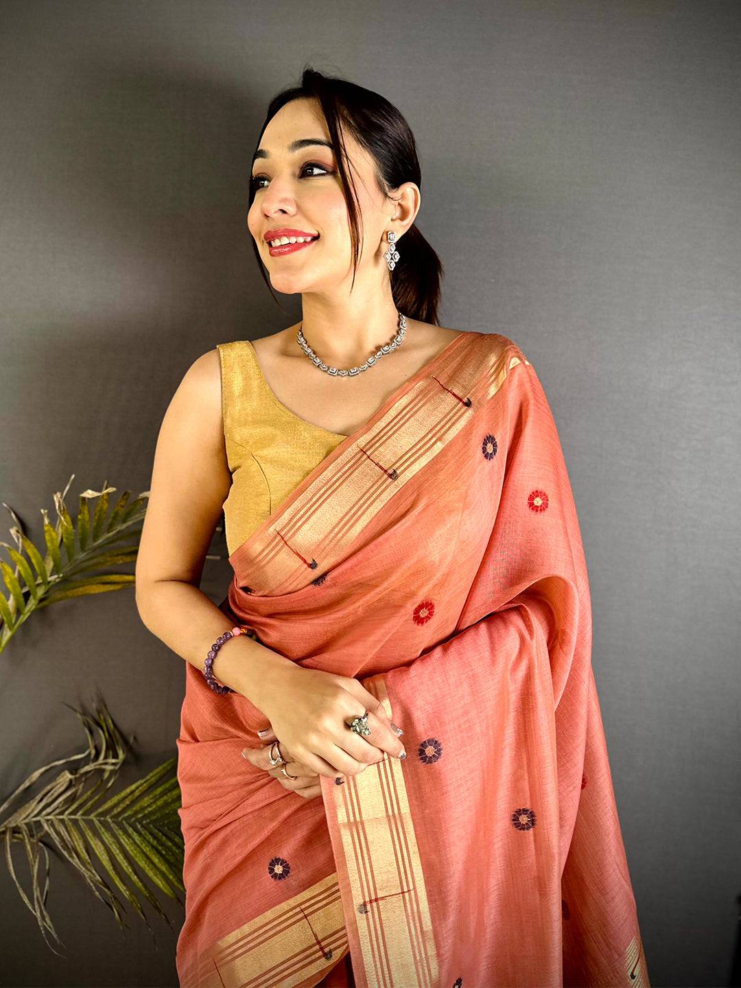 Aura Peach Minakari Butti Linen Saree
