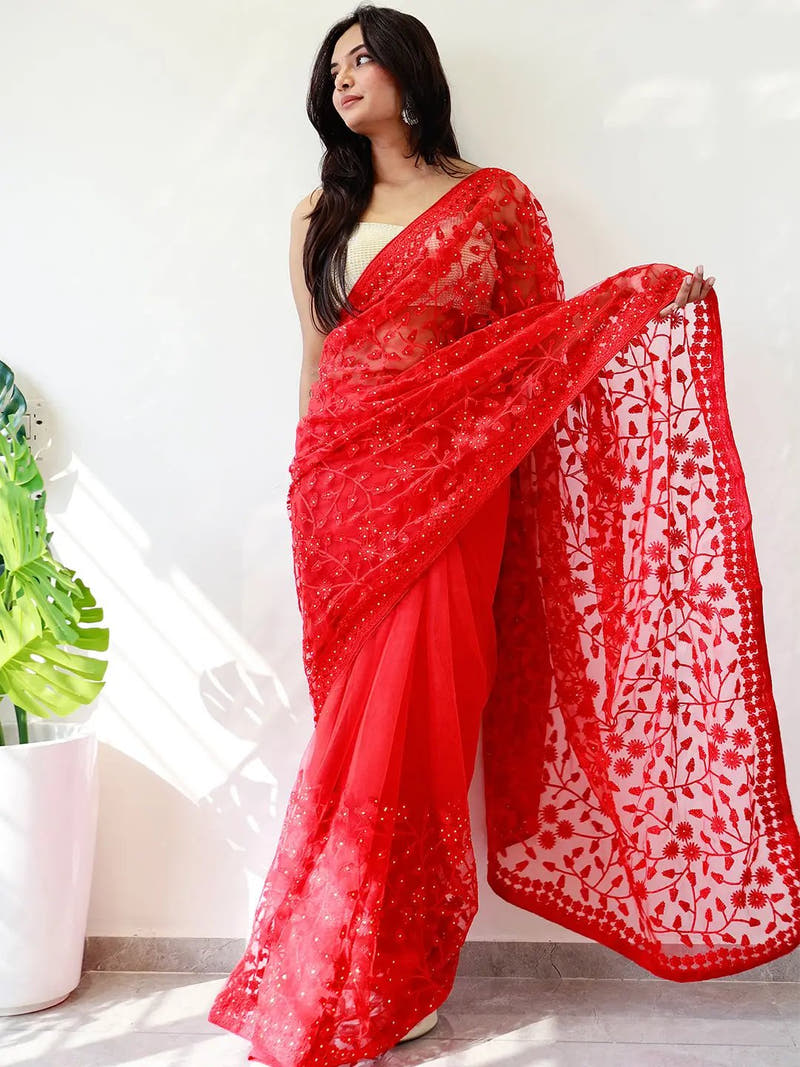 Elegant Saree Adorned with Ethnic Motifs, Intricate Threadwork, and Embellished Borders