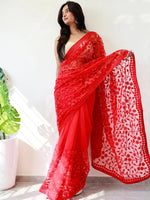 Elegant Saree Adorned with Ethnic Motifs, Intricate Threadwork, and Embellished Borders