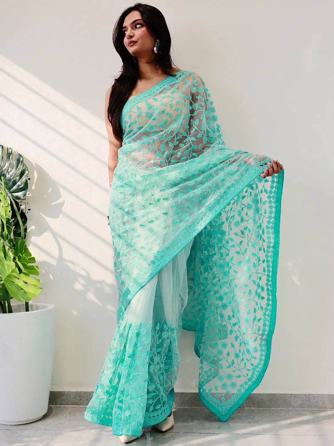 Elegant Saree Adorned with Ethnic Motifs, Intricate Threadwork, and Embellished Borders