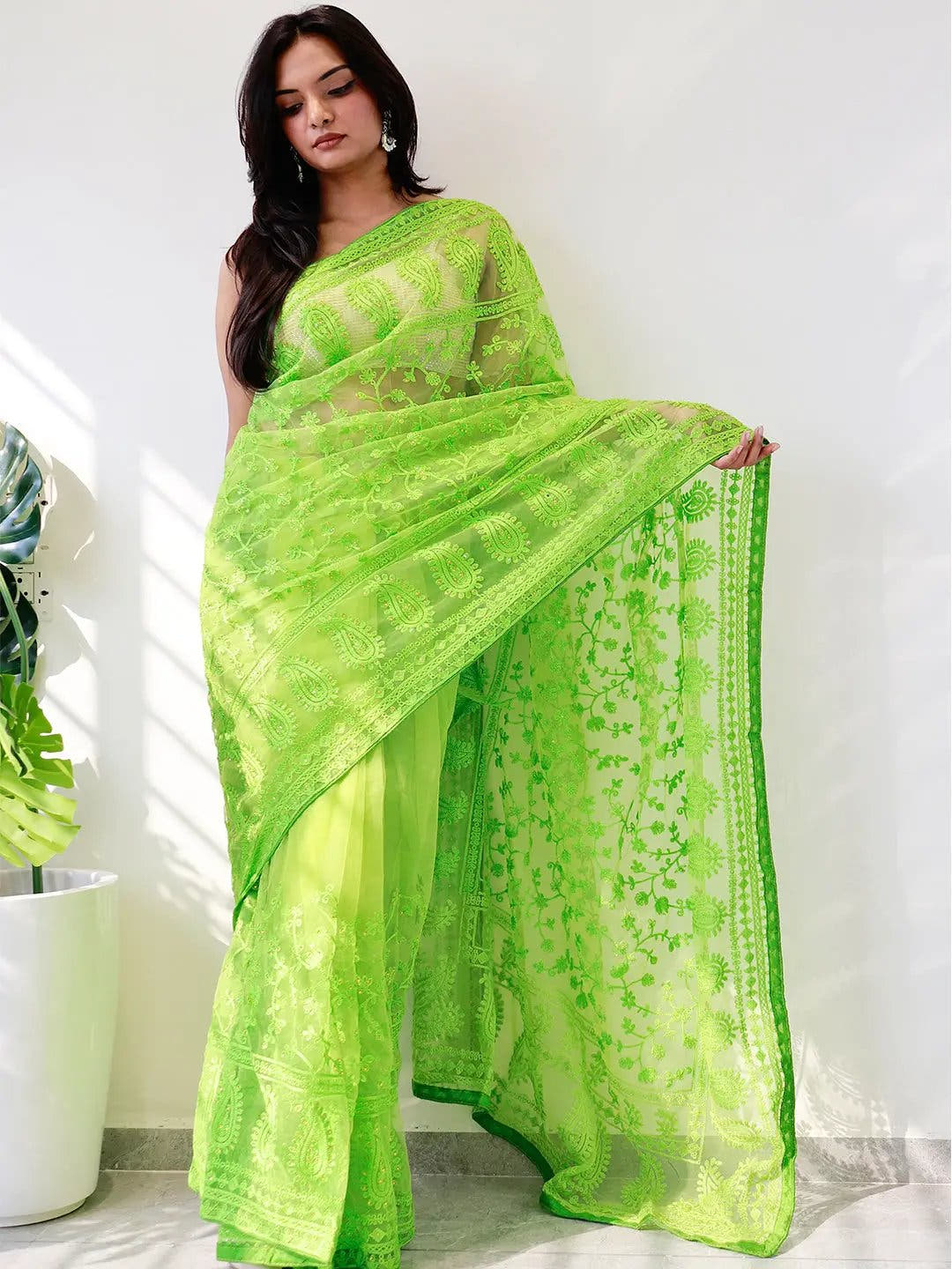 Elegant Saree Adorned with Ethnic Motifs, Intricate Threadwork, and Embellished Borders
