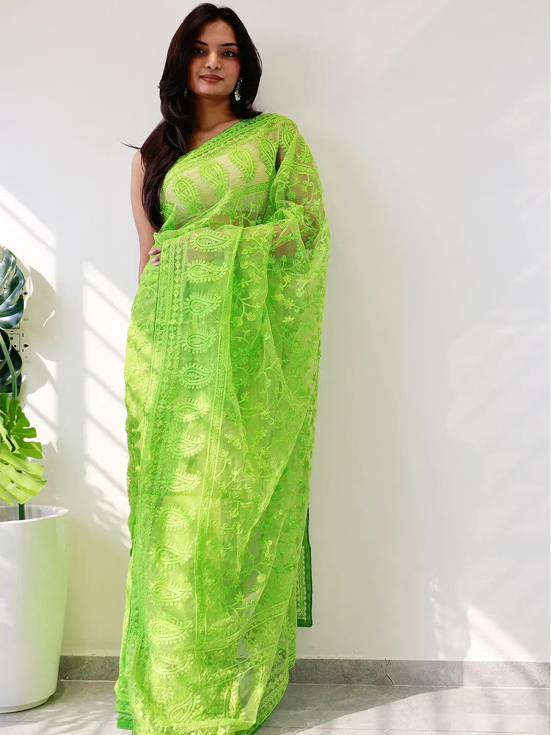 Elegant Saree Adorned with Ethnic Motifs, Intricate Threadwork, and Embellished Borders