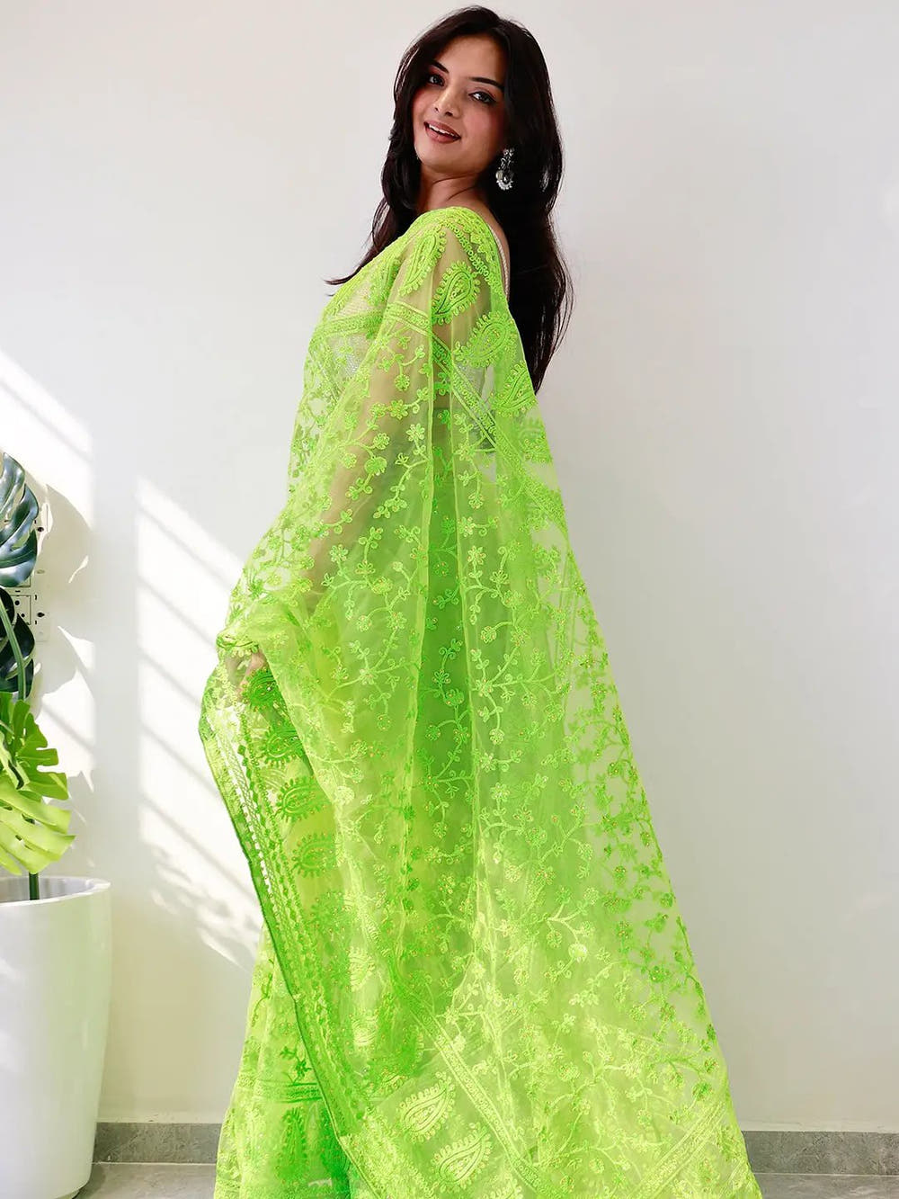 Elegant Saree Adorned with Ethnic Motifs, Intricate Threadwork, and Embellished Borders