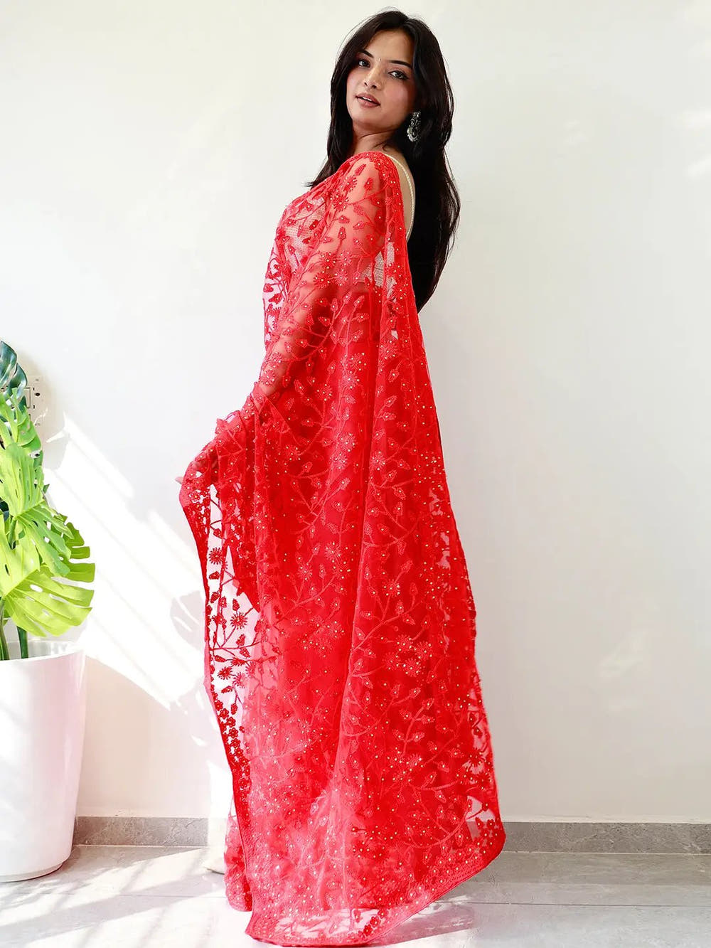 Elegant Saree Adorned with Ethnic Motifs, Intricate Threadwork, and Embellished Borders