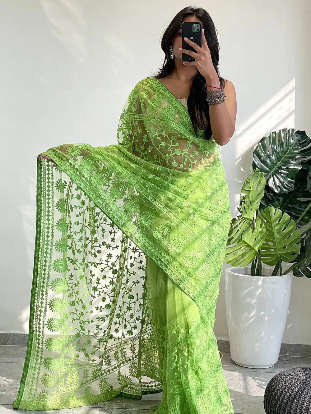 Elegant Saree Adorned with Ethnic Motifs, Intricate Threadwork, and Embellished Borders