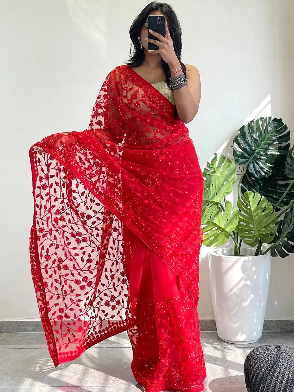 Elegant Saree Adorned with Ethnic Motifs, Intricate Threadwork, and Embellished Borders