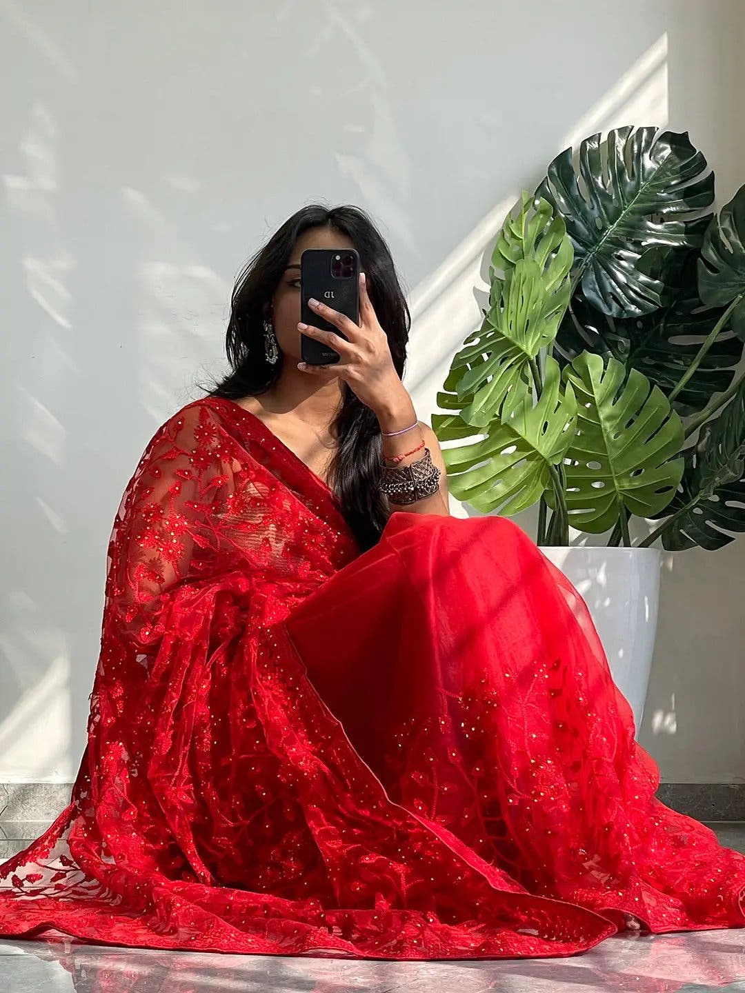 Elegant Saree Adorned with Ethnic Motifs, Intricate Threadwork, and Embellished Borders