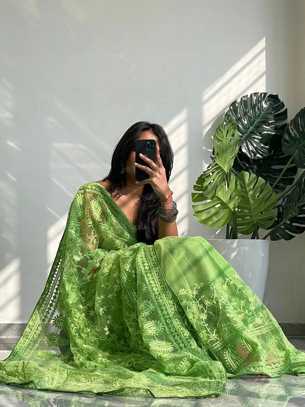Elegant Saree Adorned with Ethnic Motifs, Intricate Threadwork, and Embellished Borders